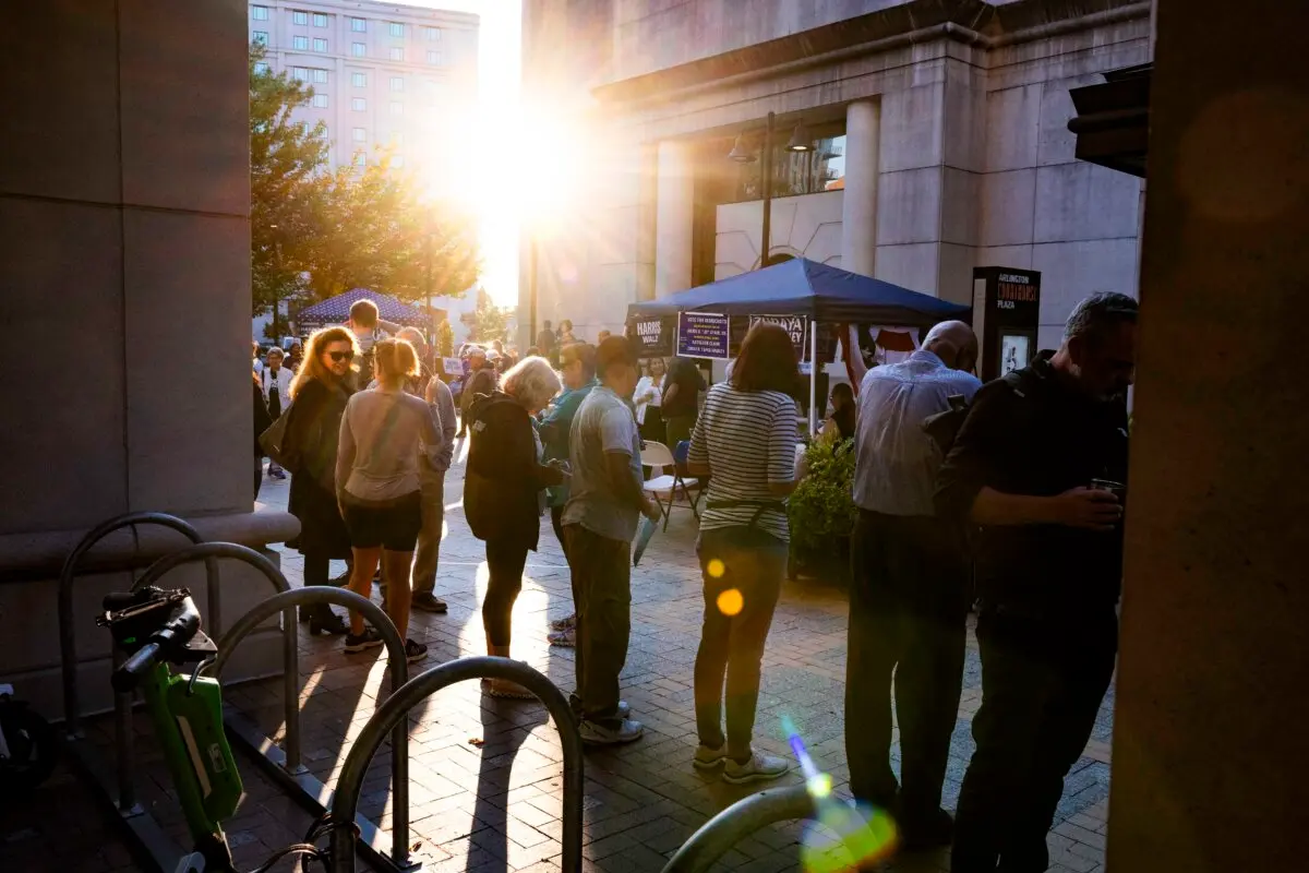 Voters wanting to cast an early vote line up outside the Elena Bozeman Government Center for a polling station to open in Arlington, Va., on Sept. 20, 2024. (AFP via Getty Images)