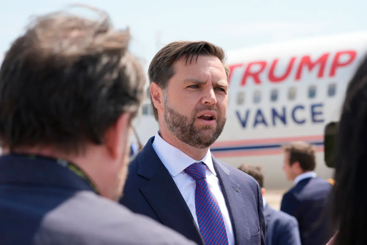 Republican vice presidential nominee Sen. JD Vance, R-Ohio, talks to reporters after walking over from looking at Air Force Two, Vice President Kamala Harris' plane, at Chippewa Valley Regional Airport, Wednesday, Aug. 7, 2024, in Eau Claire, Wis. (AP Photo/Alex Brandon)