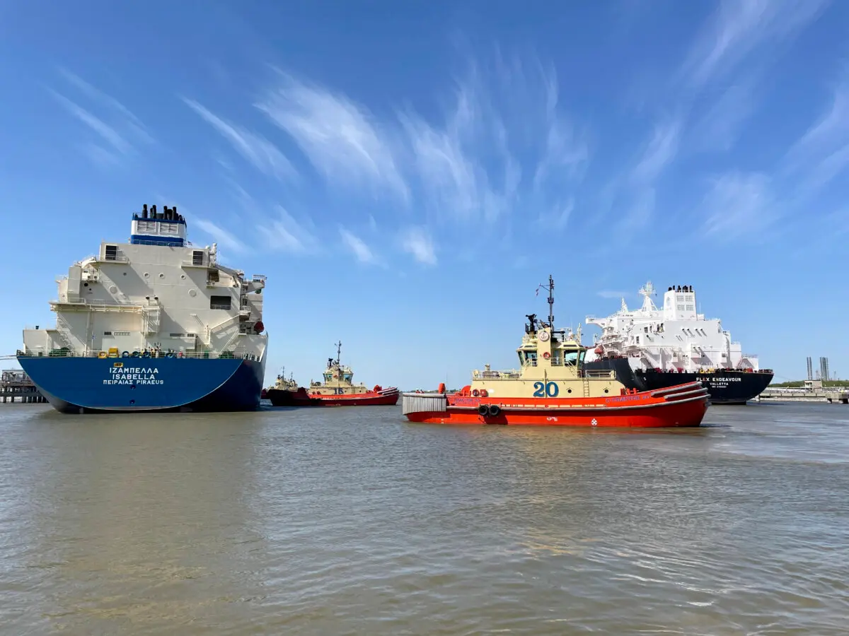 An LNG tanker is guided by tug boats at the Cheniere Sabine Pass LNG export unit in Cameron Parish, La., on April 14, 2022. (Marcy de Luna/Reuters)