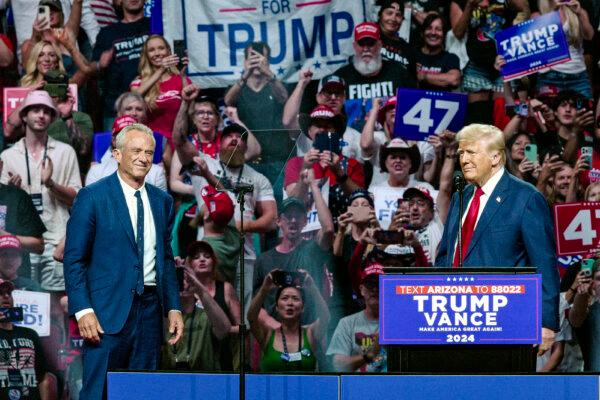 Former President Donald Trump (R) welcomes onstage independent presidential candidate Robert F. Kennedy Jr. (L) during a campaign rally in Glendale, Ariz., on Aug. 23, 2024. (Olivier Touron/AFP via Getty Images)