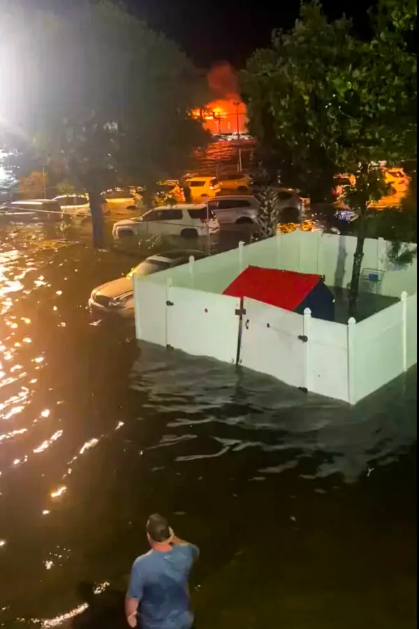 A person looks over a flooded street due to Hurricane Helene in New Port Richey, Fla., late Sept. 26, 2024. (Danielle Molisee via AP)