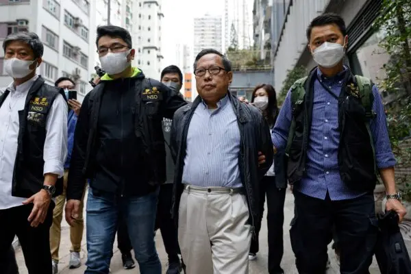 Former vice-chairman of the Hong Kong Alliance in Support of Patriotic Democratic Movements of China, Albert Ho, walks after his arrest by police in Hong Kong on March 21, 2023. (Tyrone Siu/Reuters)