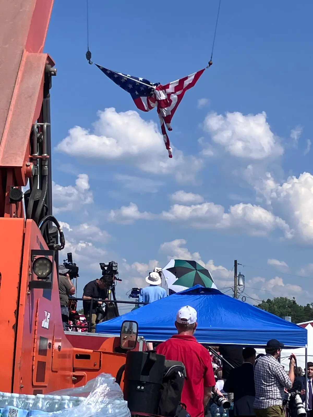 An American flag is twisted in the shape of what some people viewed as an angel about two hours before an assassination attempt on former President Donald Trump in Butler, Pa., on July 13, 2024. (Janice Hisle/The Epoch Times)