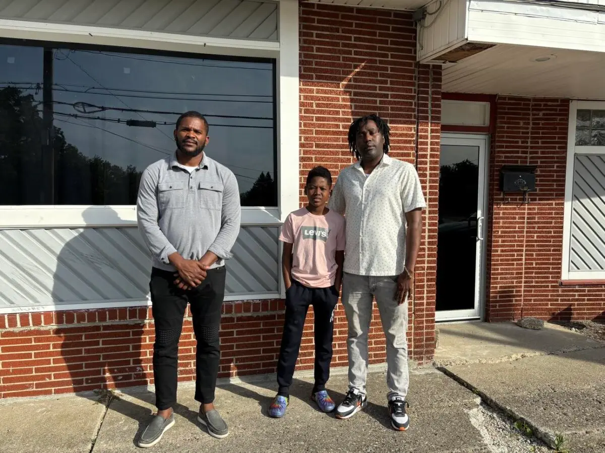 Haitian migrants Lindsay Aime (L), Marcley Joseph (C), and Malc Joseph (R) are adjusting to their new surroundings and culture on Sept. 11, 2024, in Springfield, Ohio. (Jeff Louderback/The Epoch Times)