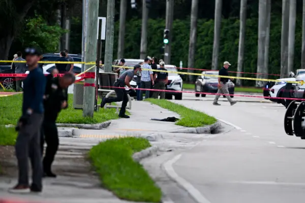 Members of the FBI, Sheriff's Department, and Secret Service outside the Trump International Golf Club in West Palm Beach, Fla., on Sept. 15, 2024. (Chandan Khanna/AFP via Getty Images)