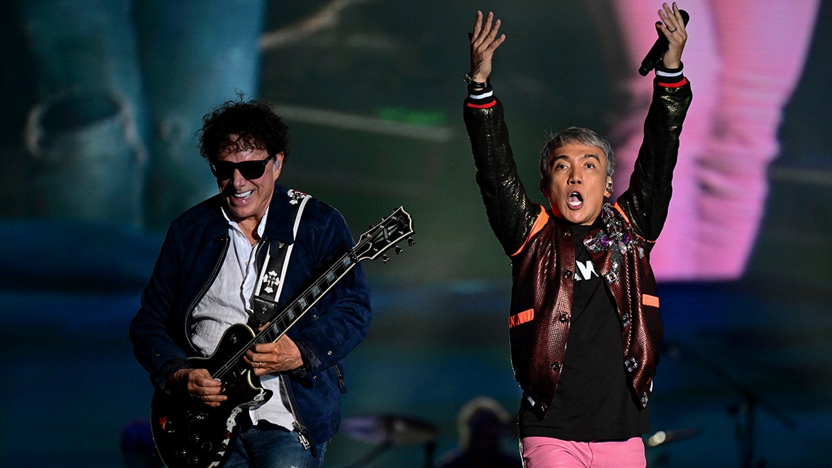 Arnel Pineda and Neal Schon perform with Journey