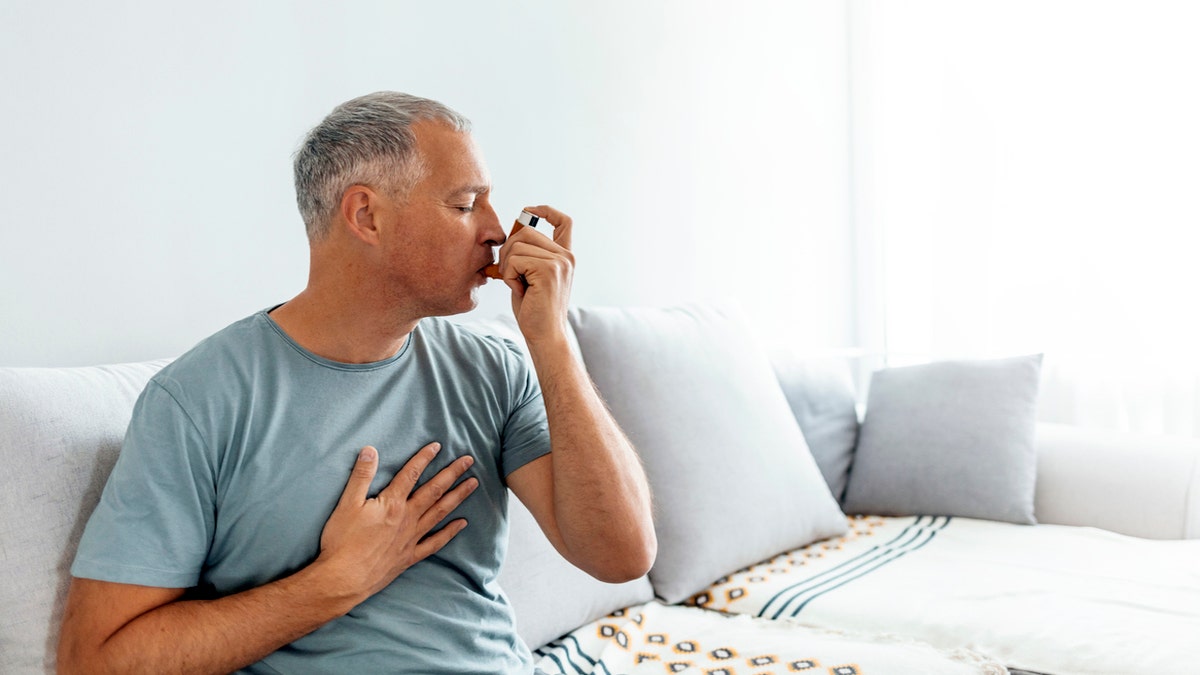 Man using inhaler