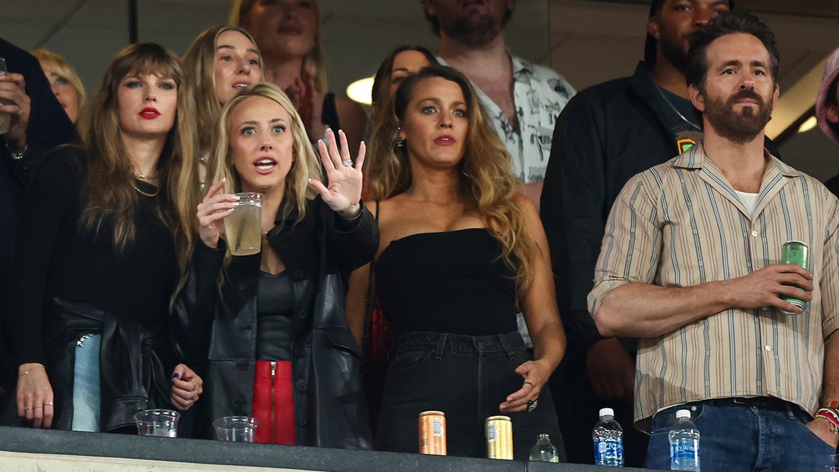 Taylor Swift, Brittany Mahomes with her hand out, Blake Lively and Ryan Reynolds watch the Kansas City Chiefs play the New York Jets