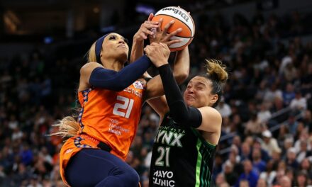 Sun’s DiJonai Carrington held back by teammate after hard foul vs Lynx