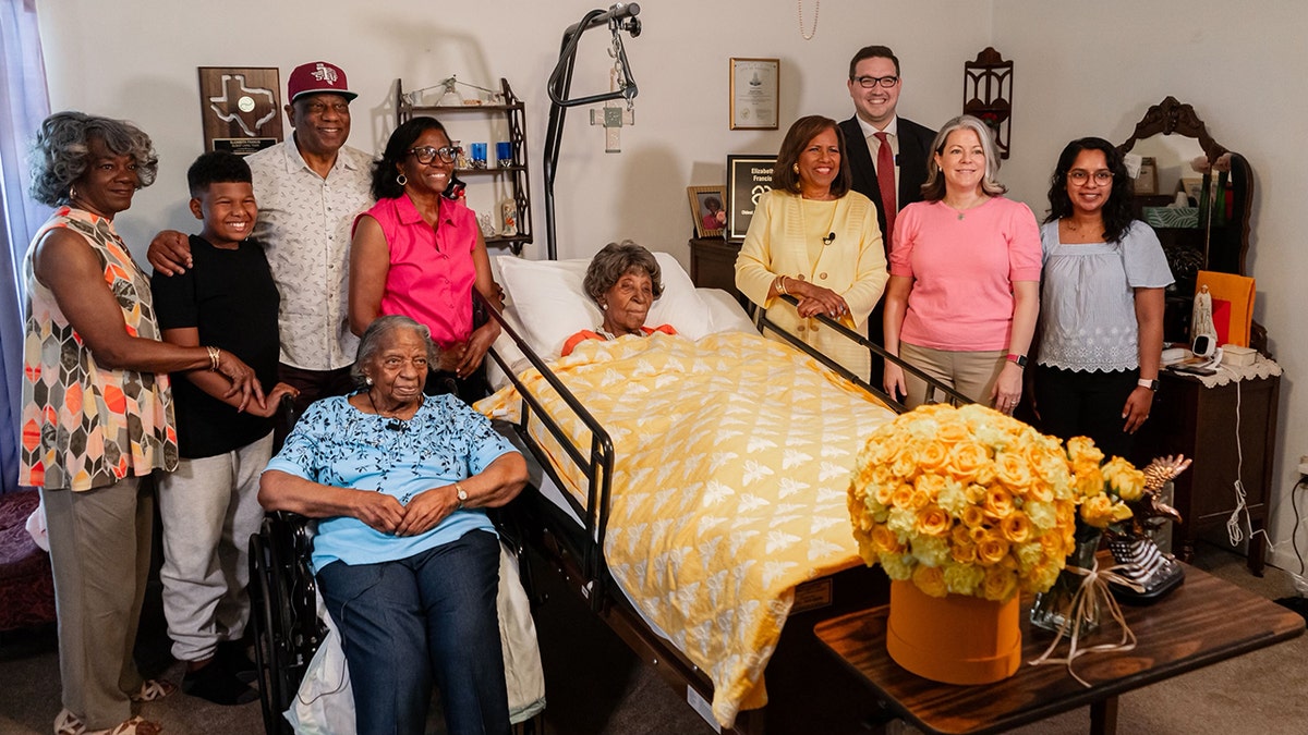 Ben Myers (pictured far right) of LongeviQuest, a global research organization that tracks human longevity, gathers with Elizabeth Francis' family members and presents her award as the oldest living American in the U.S. 