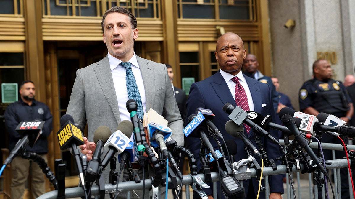 Attorney Alex Spiro speaks next to New York City Mayor Eric Adams