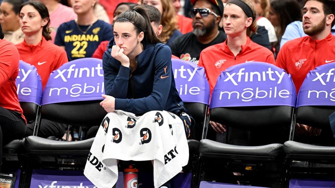 WASHINGTON, DC - SEPTEMBER 19: Caitlin Clark #22 of the Indiana Fever watches the game in the third quarter against the Washington Mystics at Capital One Arena on September 19, 2024 in Washington, DC. NOTE TO USER: User expressly acknowledges and agrees that, by downloading and or using this photograph, User is consenting to the terms and conditions of the Getty Images License Agreement. (Photo by Greg Fiume/Getty Images)