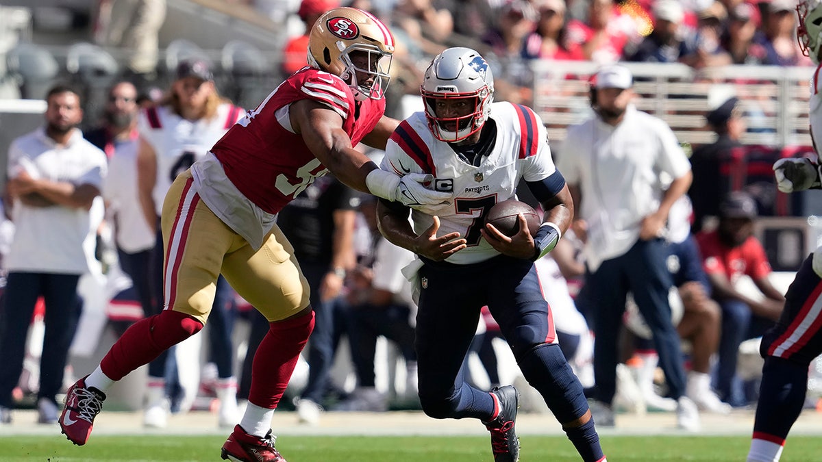 Jacoby Brissett tackled by Kevin Givens