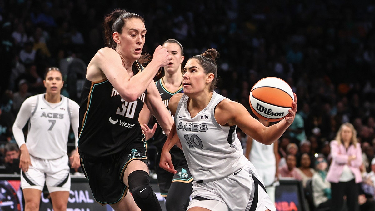 Kelsey Plum drives to the basket