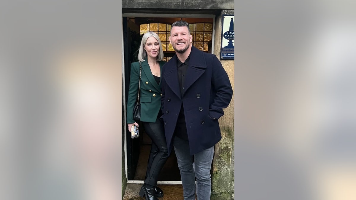 UFC champion Michael Bisping poses alongside his wife, Rebecca