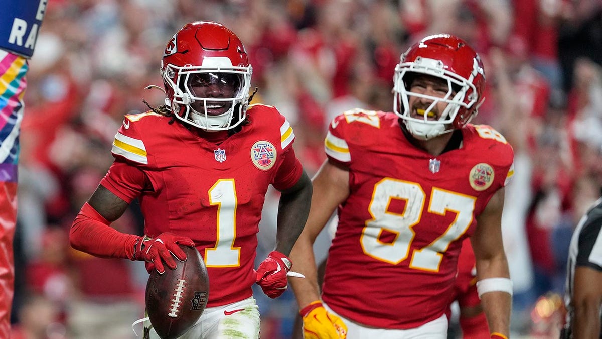 Xavier Worthy celebrates with Travis Kelce