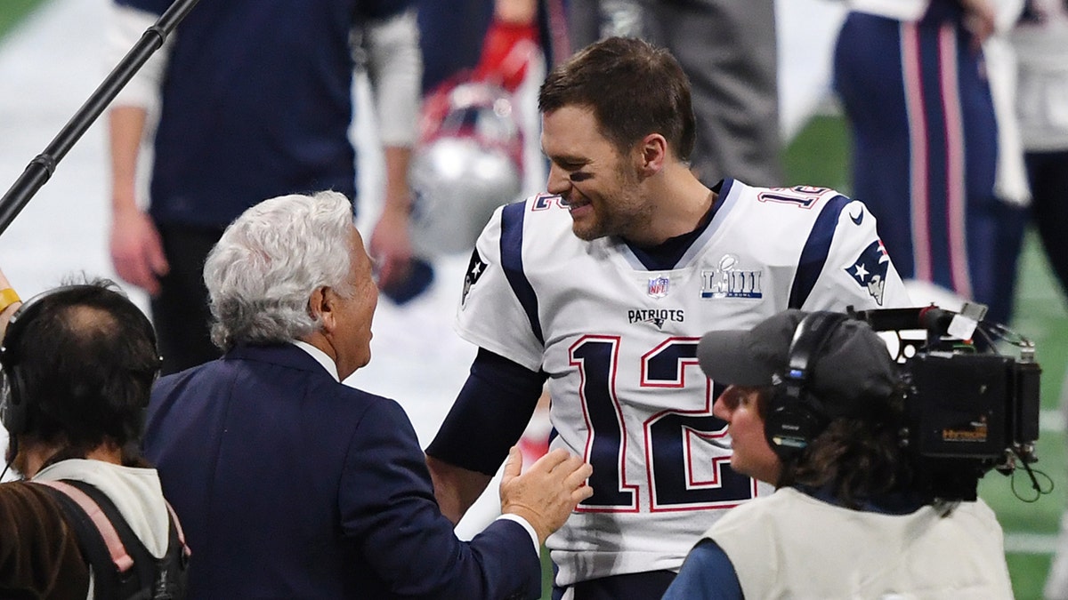 Tom Brady greets Robert Kraft