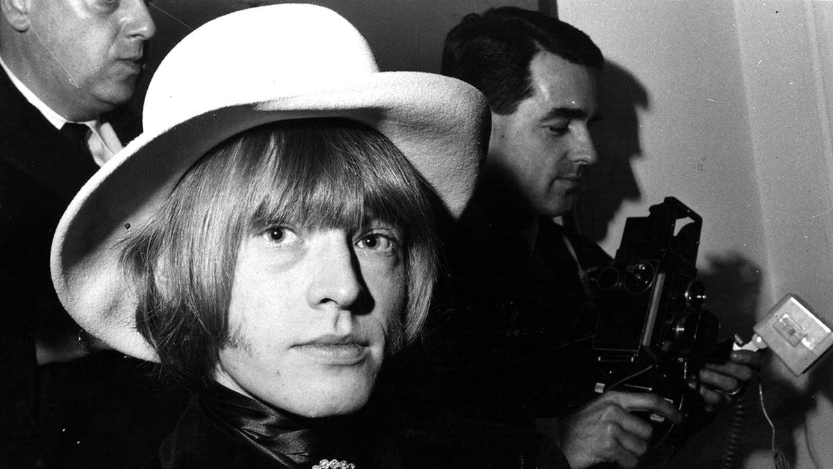 Black and white close up photo of Brian Jones of The Rolling Stones