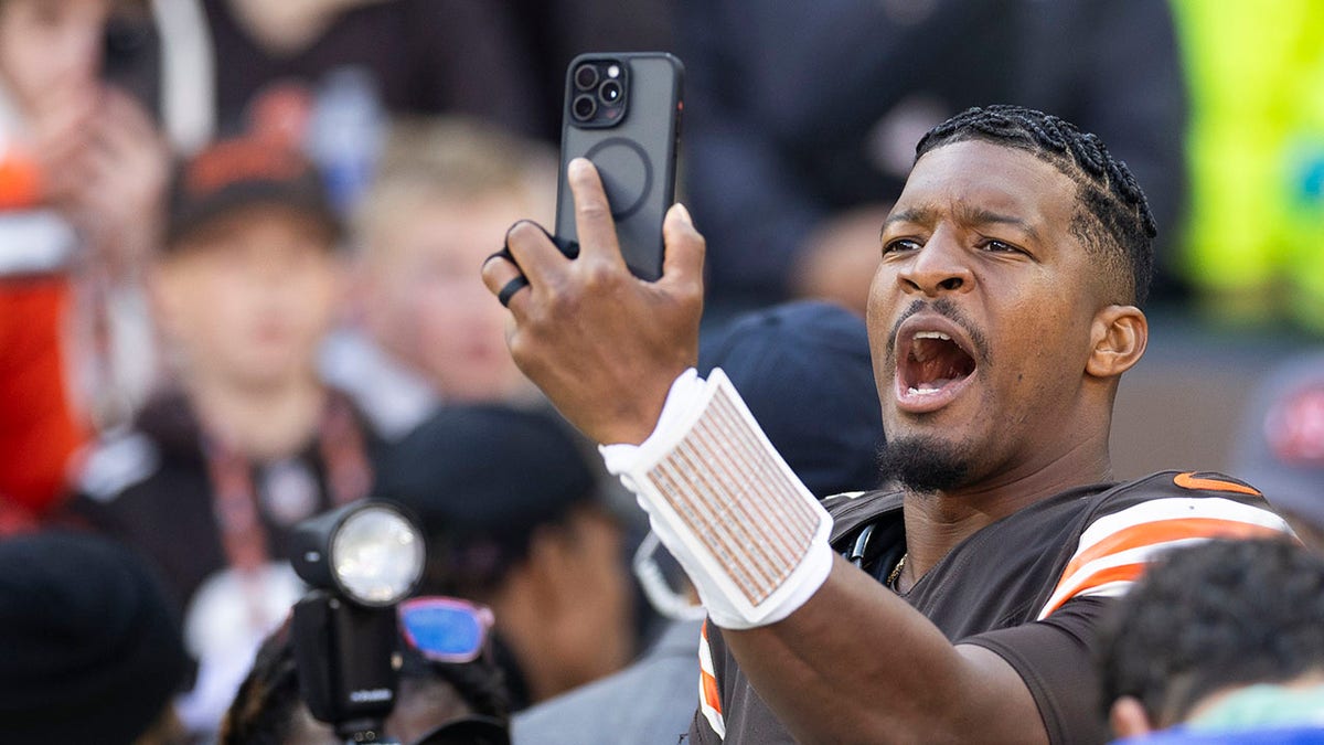 Oct 27, 2024; Cleveland, Ohio, USA; Cleveland Browns quarterback Jameis Winston (5) takes a selfie after defeating the Baltimore Ravens at Huntington Bank Field. Mandatory Credit: Scott Galvin-Imagn Images