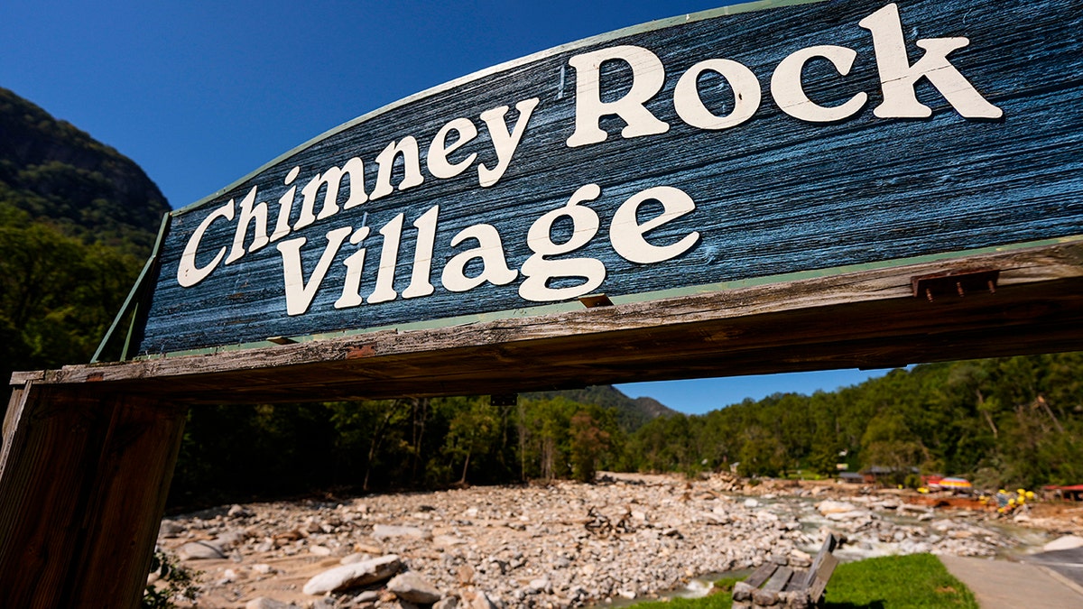 Chimney Rock sign in front of hurricane damage