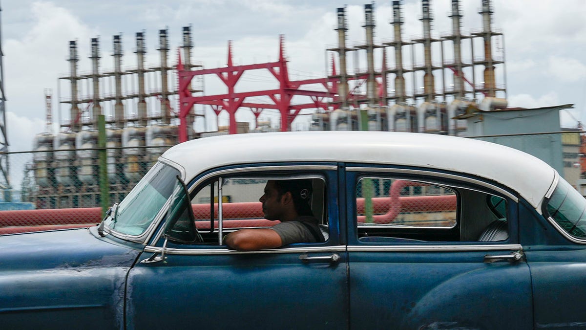 A car in Cuba near a power plant