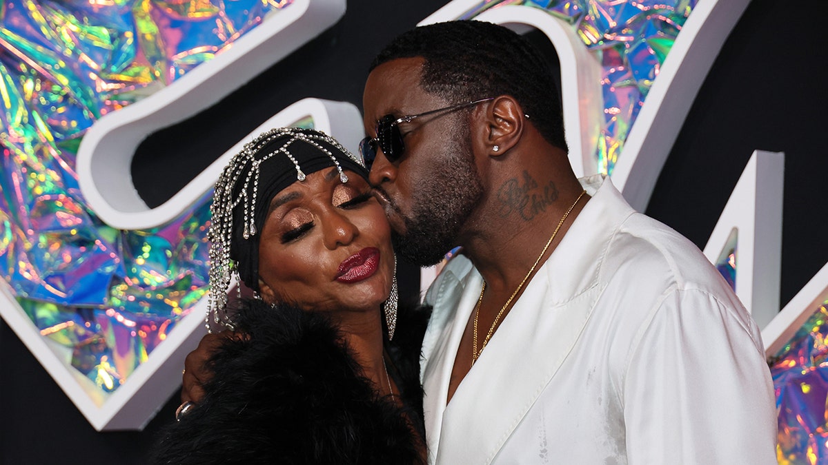 Sean Diddy Combs wears white shirt at VMAs with his mom, Janice Combs.