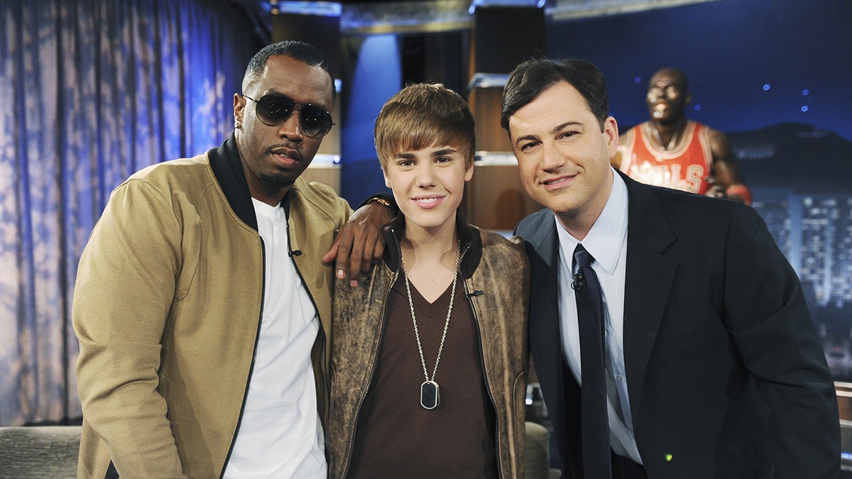 Justin Bieber wears bomber jacket to match Sean Diddy Combs while Jimmy Kimmel wears a blazer.