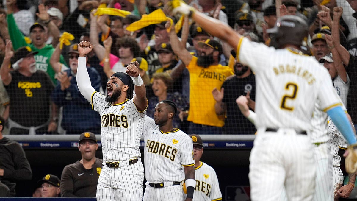 Fernando Tatis Jr waves the towel