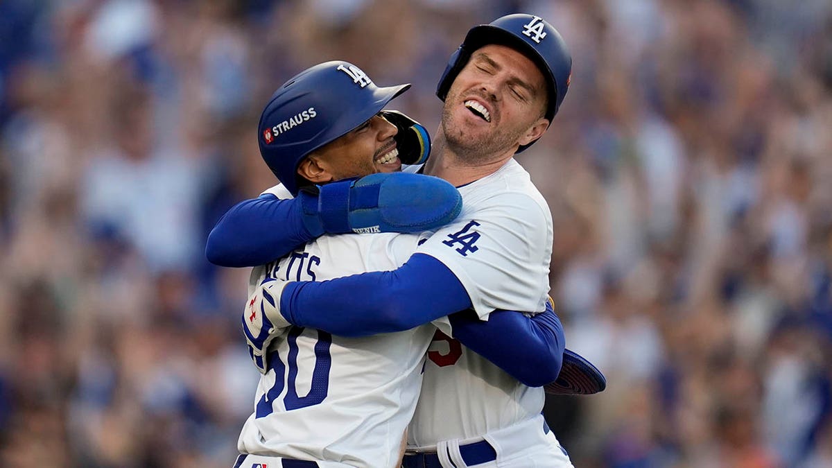 Freddie Freeman and Mookie Betts hug