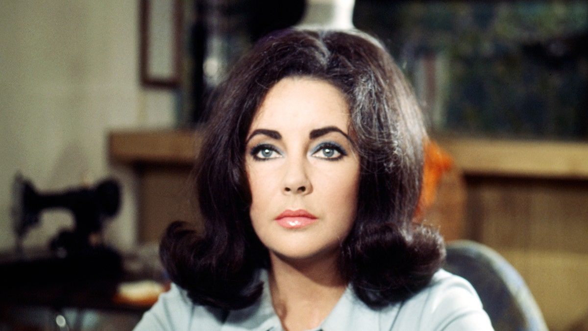 A close-up of Elizabeth Taylor looking pensive