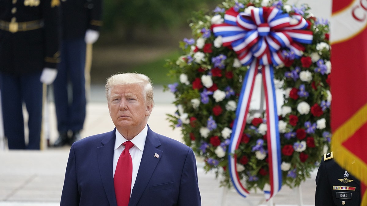 Former President Donald Trump with military wreath at Arlington National Cemetery