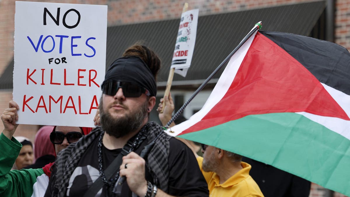 Pro-Palestinian demonstrators protest in support of the Palestinians who have died in Gaza outside of the Arab American National Museum in Dearborn, Michigan. (Photo by JEFF KOWALSKY / AFP) (Photo by JEFF KOWALSKY/AFP via Getty Images)