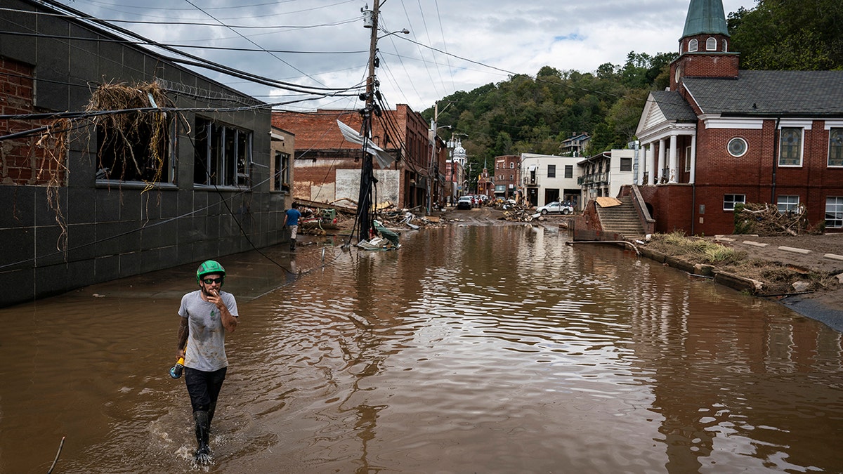 Man wades through Helene waters in NC