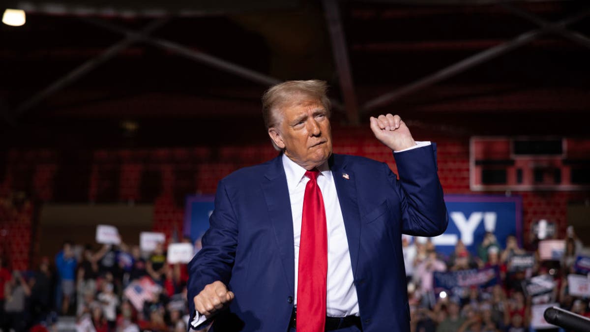 Donald Trump pumping fist at Michigan rally