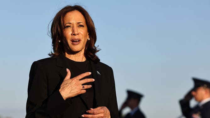 CHARLOTTE, NORTH CAROLINA - OCTOBER 05: Democratic presidential nominee, Vice President Kamala Harris speaks to the media before boarding Air Force Two after assessing the Hurricane Helene recovery response in North Carolina on October 5, 2024 in Charlotte, North Carolina. Harris was briefed on recovery operations at the Charlotte Air National Guard Base, visited a donation drop-off site for storm victims and met with impacted families. According to the Vice President’s office, 74 percent of people who lost electricity during the storm now have power restored. (Photo by Mario Tama/Getty Images)