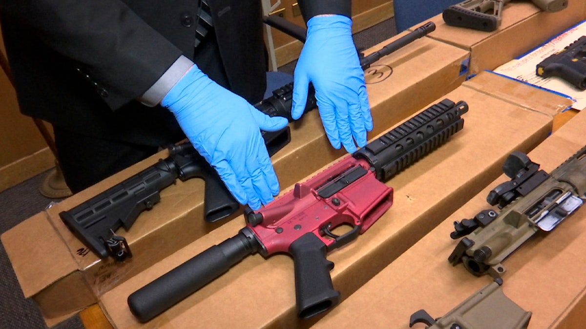 Ghost guns are displayed at a police department.