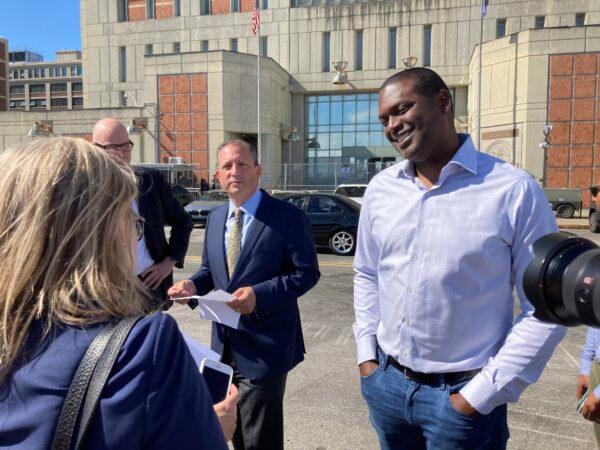 Comptroller Brad Lander and Congressman Mondaire Jones gather before a press conference in front of the Metropolitan Detention Center in Sunset Park, Brooklyn, N.Y., on Aug. 16, 2022. (David Wagner/The Epoch Times)