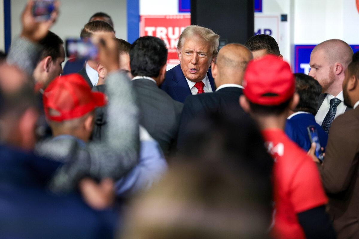 Republican presidential nominee, former President Donald Trump, greets supporters and staff as he visits a campaign office in Hamtramck, Mich., on Oct. 18, 2024. (Win McNamee/Getty Images)