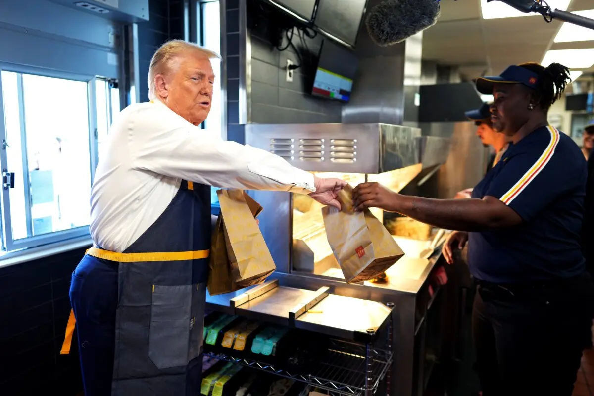 Former President Donald Trump works behind the counter during a visit to McDonald's restaurant in Feasterville-Trevose, Pa., on Oct. 20, 2024. (Doug Mills-Pool/Getty Images)