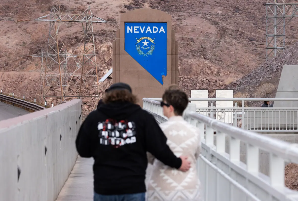 People walk near the Hoover Dam outside of Boulder City, Nev., on Oct. 19, 2024. (John Fredricks/The Epoch Times)