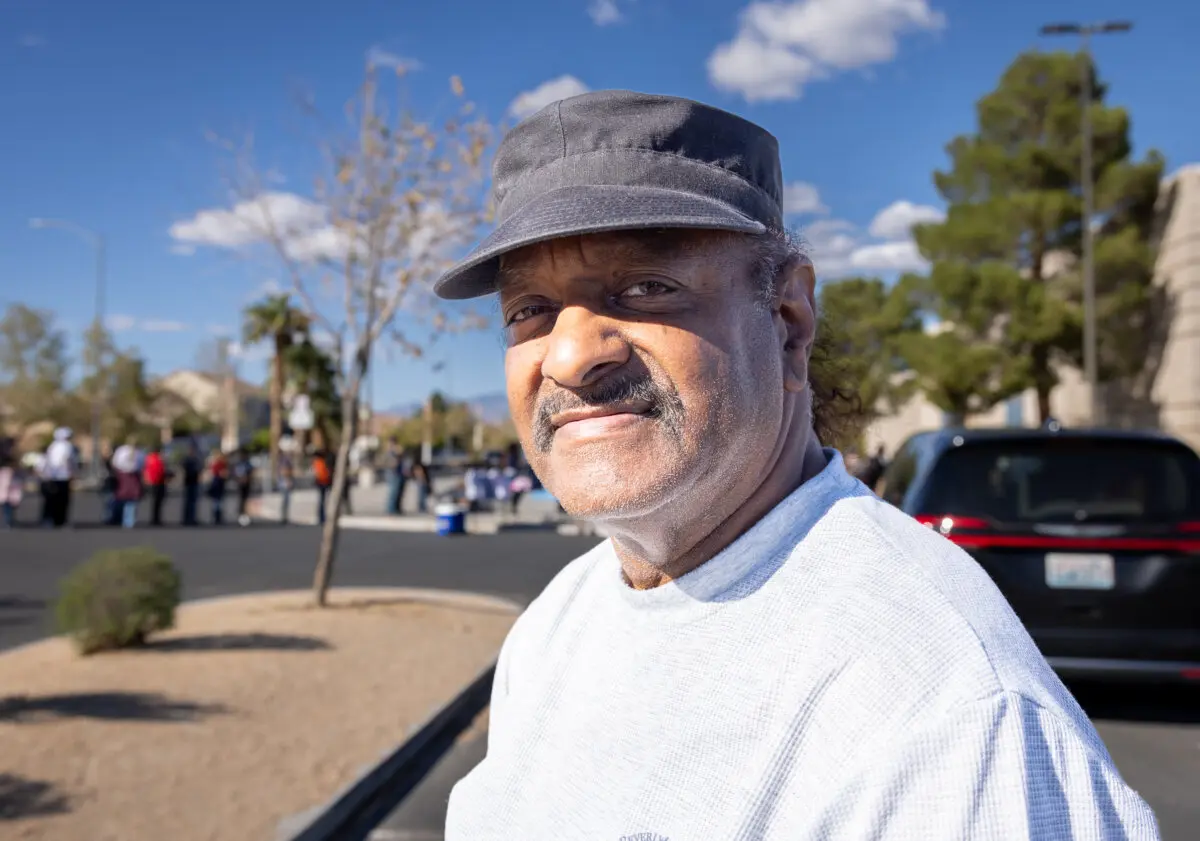 Charles Johnson waits in line to hear former President Barack Obama speak in North Las Vegas, Nev., on Oct. 19, 2024. (John Fredricks/The Epoch Times)