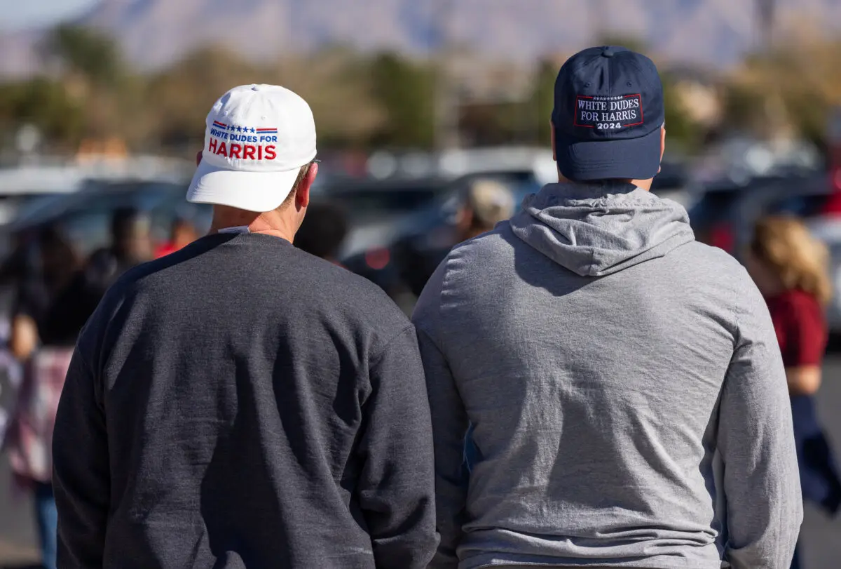 Lance (R) and Jack (L) wait in line to hear former U.S. President Barrack Obama speak in North Las Vegas, Nev., on Oct. 19, 2024. (John Fredricks/The Epoch Times)