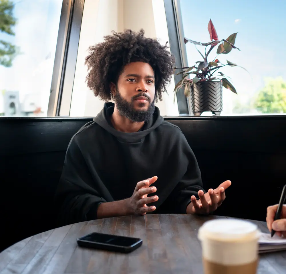 Mark Ruff speaks during an interview with The Epoch Times at a coffee shop in Royal Oak, Mich., on Oct. 12, 2024. (Madalina Vasiliu/The Epoch Times)