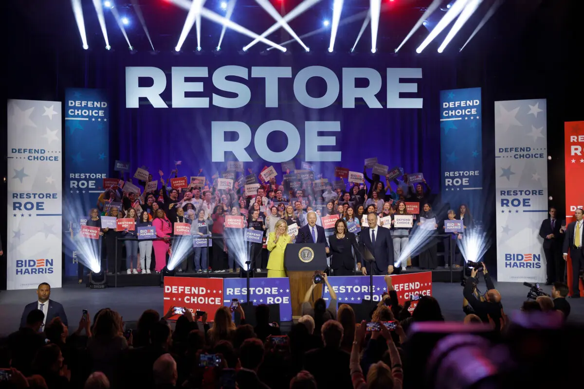 (L to R) First lady Jill Biden, U.S. President Joe Biden, U.S. Vice President Kamala Harris and Second gentleman Douglas Emhoff join hands at a rally in Manassas, Va., on Jan. 23, 2024. (Anna Moneymaker/Getty Images)