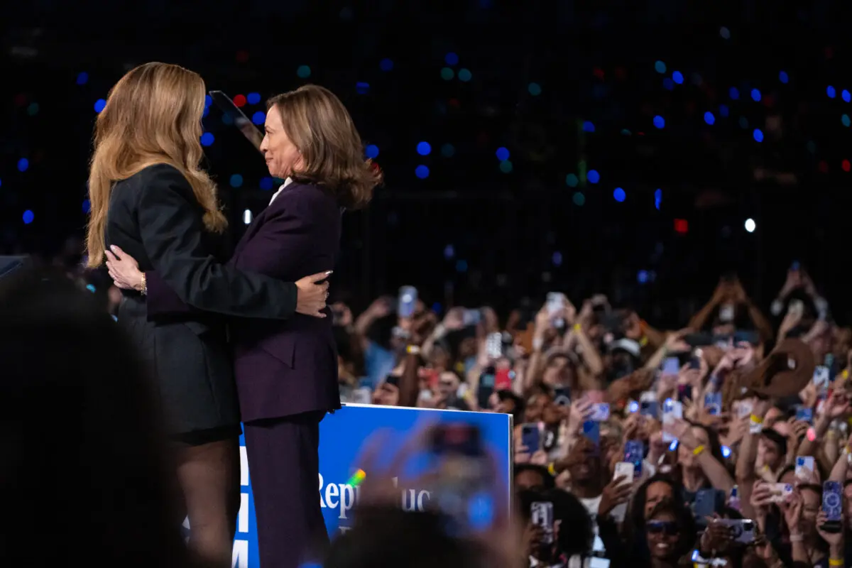 Vice President and Democratic presidential candidate Kamala Harris (R) embraces US singer-songwriter Beyonce onstage during a campaign rally at Shell Energy Stadium in Houston, Texas, on Oct. 25, 2024. (ROBERTO SCHMIDT/AFP via Getty Images)