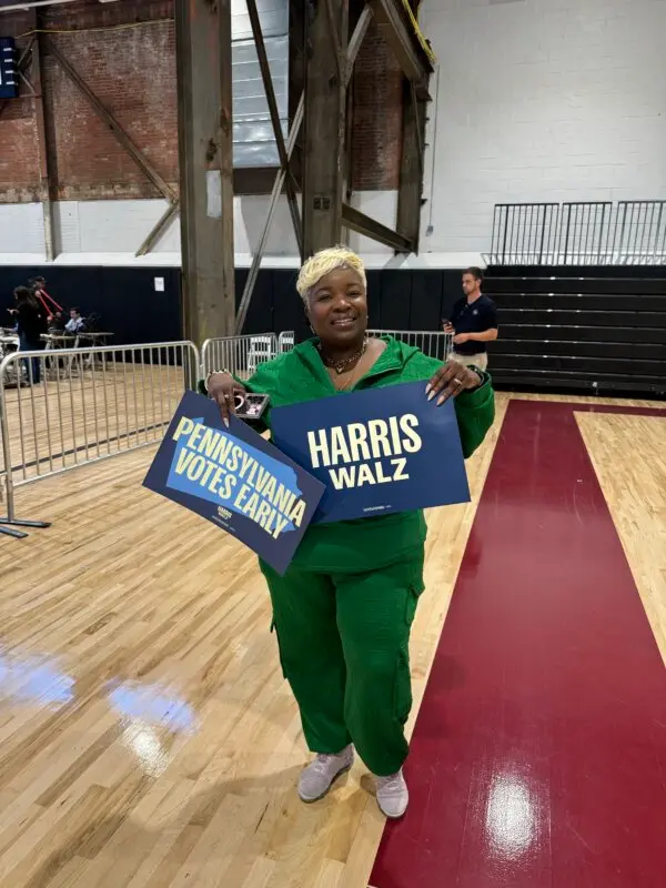 Cordelia Johnson, a poll worker for the Harris-Walz campaign, attends a 