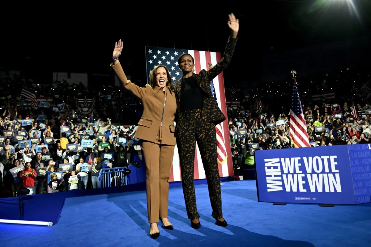 US Vice President and Democratic presidential candidate Kamala Harris (L) and former US First Lady Michelle Obama arrive to speak at a campaign rally in Kalamazoo, Michigan, on Oct. 26, 2024. (Brendan Smialowski/AFP)