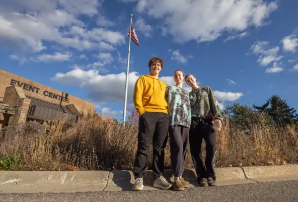 Nathan Rehm, Winter Runyan, and Gabby Runyan at an early voting site in Waterford Oaks, Mich., on Oct. 26, 2024. (John Fredricks/The Epoch Times)