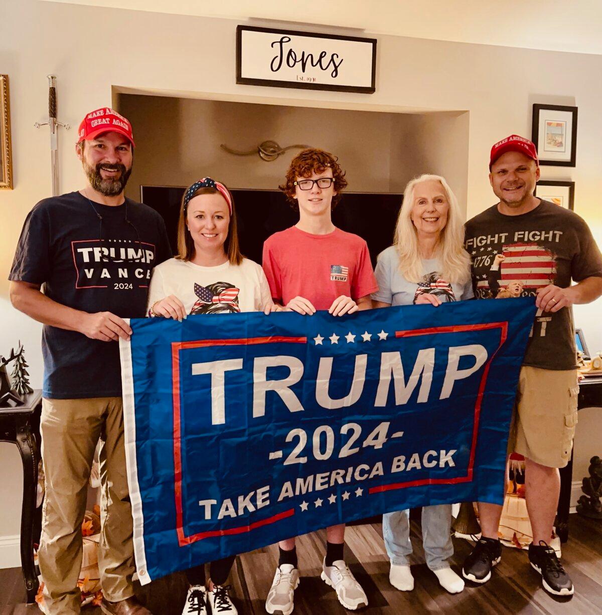 (L-R) Jeremy Pulliam, of Leeds, Alabama, with his wife, Britney Pulliam; son, Luke Pulliam, 13; and friends Donna Jones and Brad Jones, pose for a photo at the Joneses’ home near Butler, Pennsylvania, before heading to a rally for former President Donald Trump on Oct. 5, 2024. (Courtesy of Brad Jones)