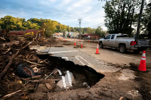 A motorist passes flood damage at a bridge across Mill Creek in the aftermath of Hurricane Helene in Old Fort, N.C., on Sept. 30, 2024. (Sean Rayford/Getty Images)